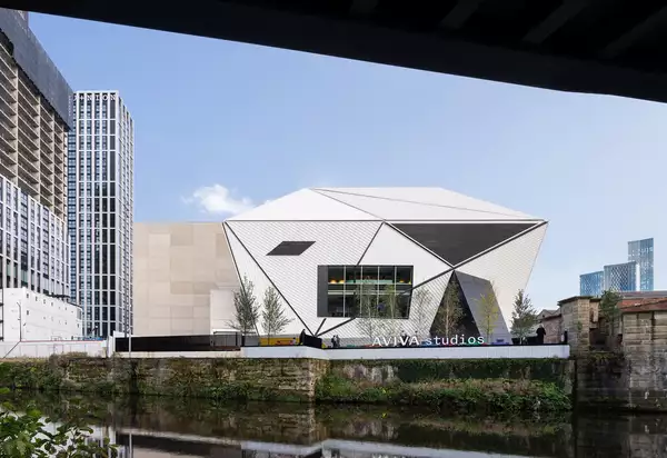 Photo of the exterior of Aviva Studios from across the river