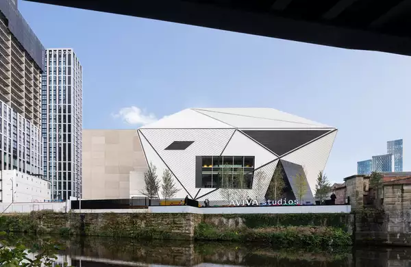 Photo of the exterior of Aviva Studios from across the river