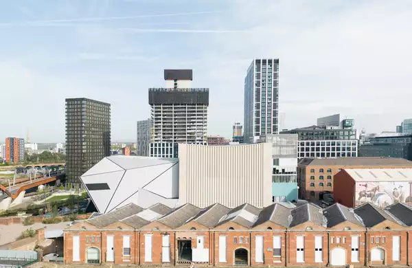 Aviva Studios and Manchester skyline viewed from a distance