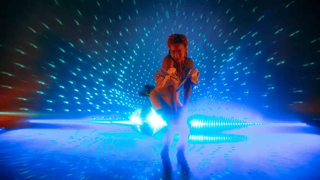 B!TEZ stands in front of a disco ball photographed by Marieke Macklon