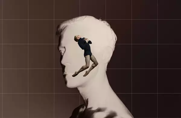 A digital collage features a grayscale side profile of a man's face, with a dancer emerging from within, positioned in a dramatic pose. The background is divided into a warm brown and a grid-like structure, enhancing the contrast between the two figures.