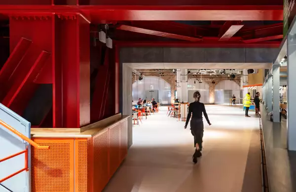 Interior of Aviva Studios with a visitor walking through