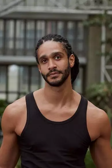 Headshot of Harry Alexander wearing a black vest