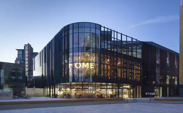 The exterior of the HOME Manchester building photographed at dusk