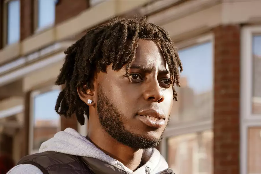 Rootz walking down a suburban street looking to the side