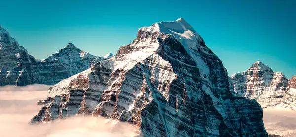 A picture of mountains against a blue sky