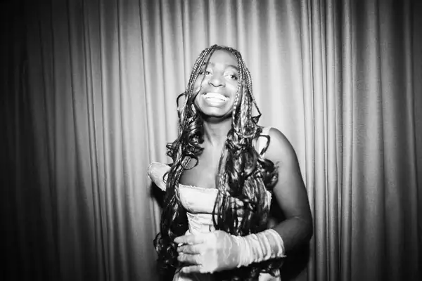 A black and white photography of Factory+ Editor in Residence smiling