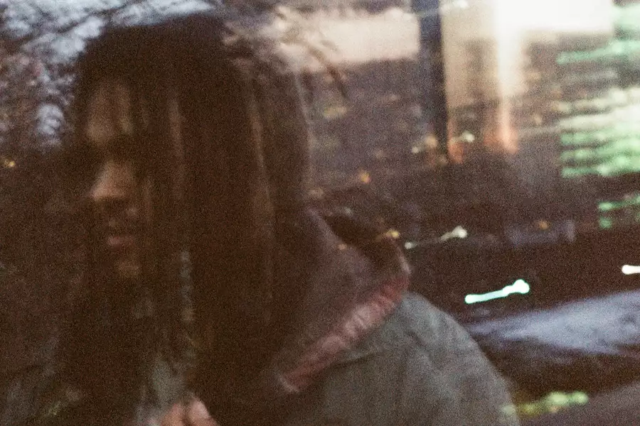 Blurry photo of Kop-Z taken through a window