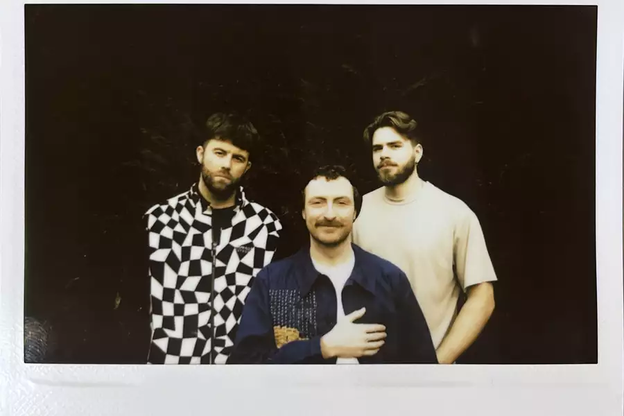 A polaroid of Bethlehem Casuals standing in a dark space.