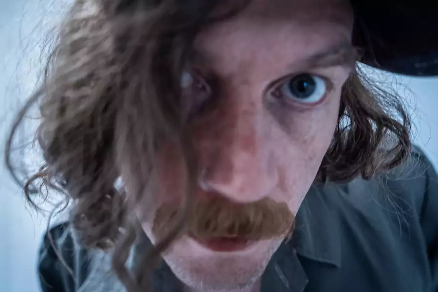 Close-up photo of See Thru Hands looking into the camera