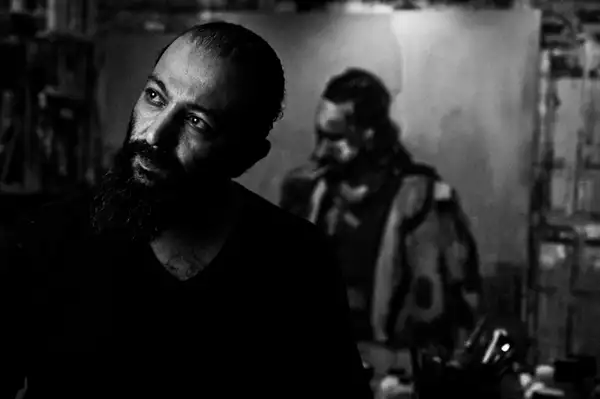 A black and white self portrait of artist Shareef Sarhan