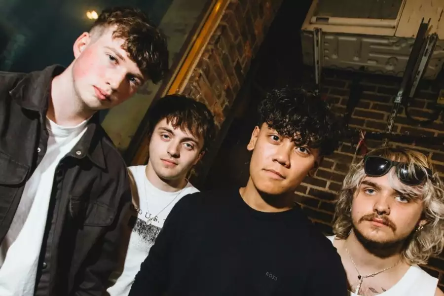 Four members of PoolEra staring at the camera. The photo is tilted clockwise.