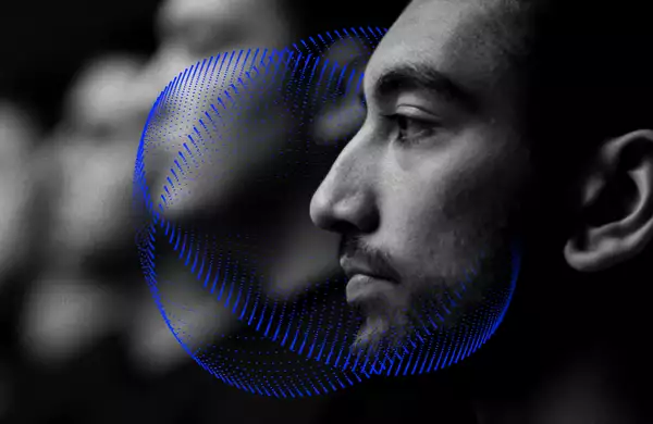 A still from the film In Camera. The lead actor is in side profile looking to the left.